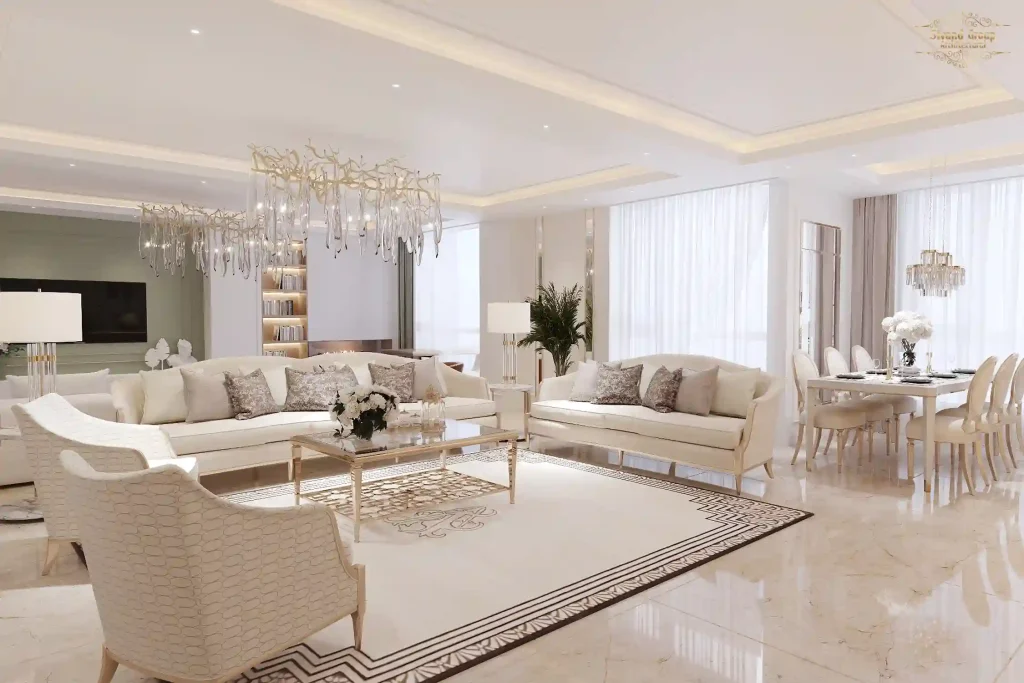 تصویری از یک طراحی داخلی لوکس و نئوکلاسیک برای واحد 160 متری در شیراز که شامل فضای نشیمن و غذاخوری با مبلمان کرم رنگ، لوسترهای کریستالی و کفپوش مرمر سفید است.