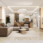 این تصویر یک فضای نشیمن و آشپزخانه مدرن با مبلمان L شکل، شومینه و نورپردازی خطی است.