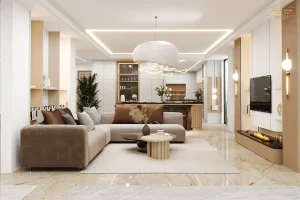 نمایی از طراحی داخلی یک سالن پذیرایی و آشپزخانه مدرن با طراحی مینیمال و نورپردازی مخفی، مبلمان رنگ خنثی و کف‌پوش سنگی براق